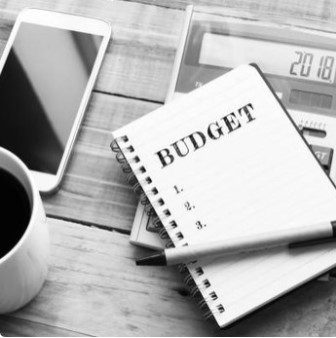 Close up of a Phone, Calculator and Notepad